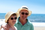 A senior couple on holiday at the seaside.
